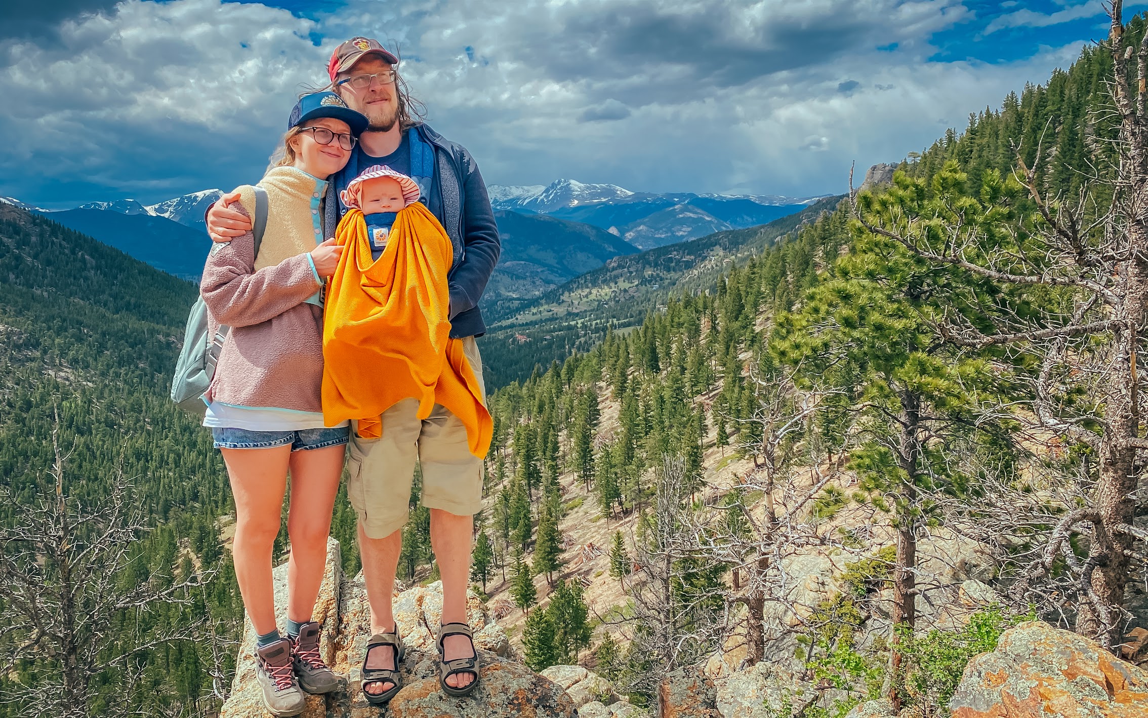 Family standing together on a mountain overlook